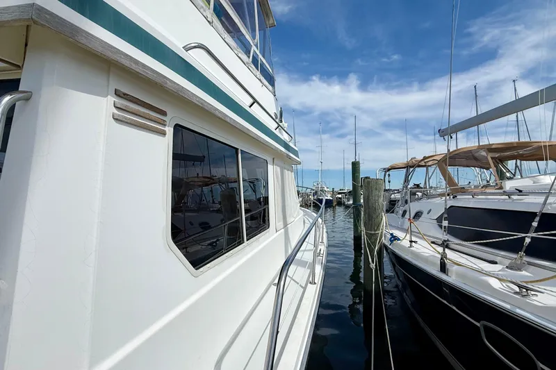 Daystar Yacht Photos Pics 2001 Sabre Sabreline 34 yacht docked at marina under blue sky.