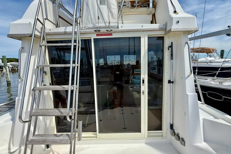 Daystar Yacht Photos Pics 2001 Sabre Sabreline 34 yacht with sliding glass doors and exterior ladder.