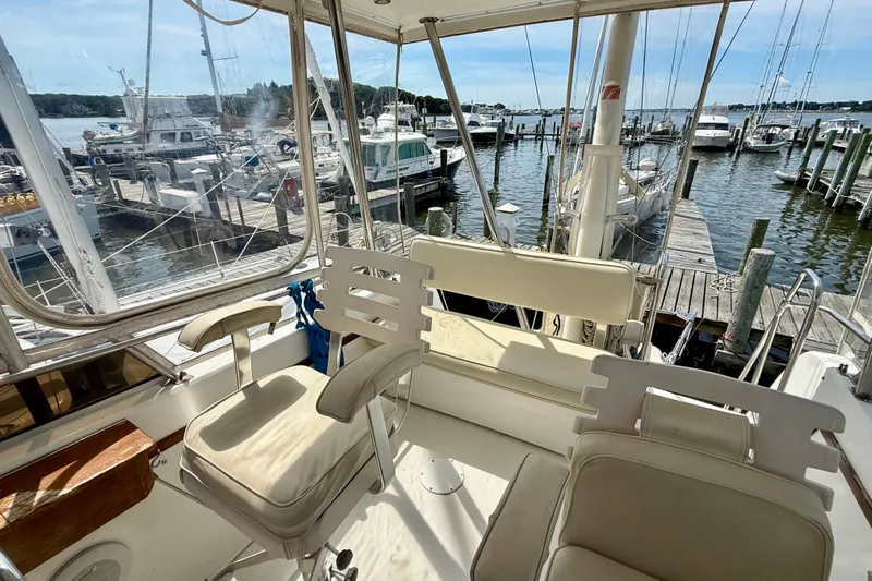 Daystar Yacht Photos Pics 2001 Sabre Sabreline 34 yacht interior with marina view, featuring comfortable seating.