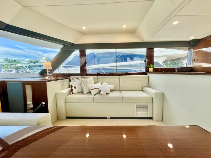 Waves III Yacht Photos Pics Luxurious interior of 2017 Maritimo M51 yacht with elegant seating and large windows.