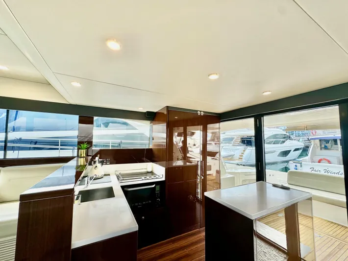 Waves III Yacht Photos Pics Luxurious interior of 2017 Maritimo M51 yacht with modern kitchen and sleek design.