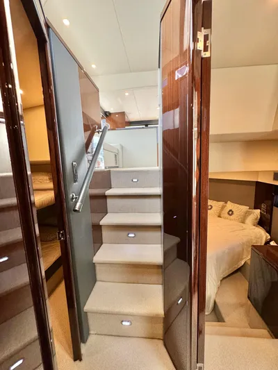 Waves III Yacht Photos Pics Interior of 2017 Maritimo M51 yacht with elegant stairs and cozy bedroom.