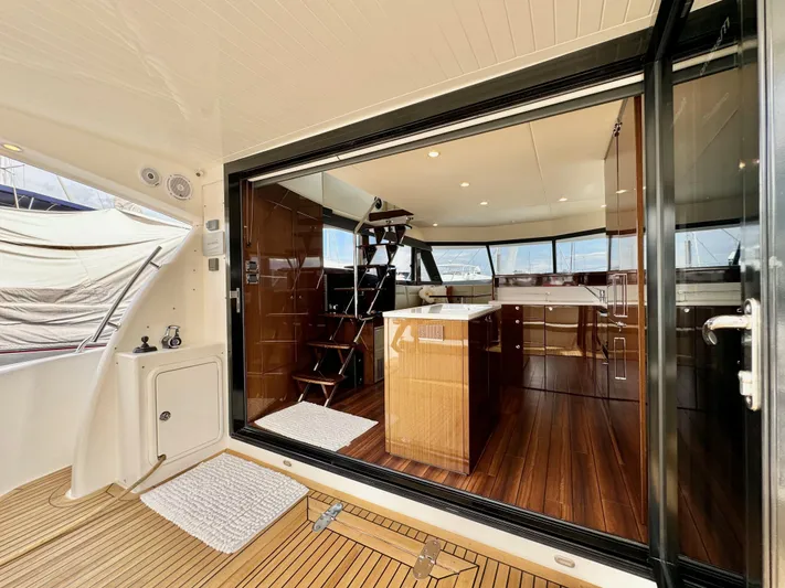 Waves III Yacht Photos Pics Luxurious interior of 2017 Maritimo M51 yacht with wooden flooring and modern design.