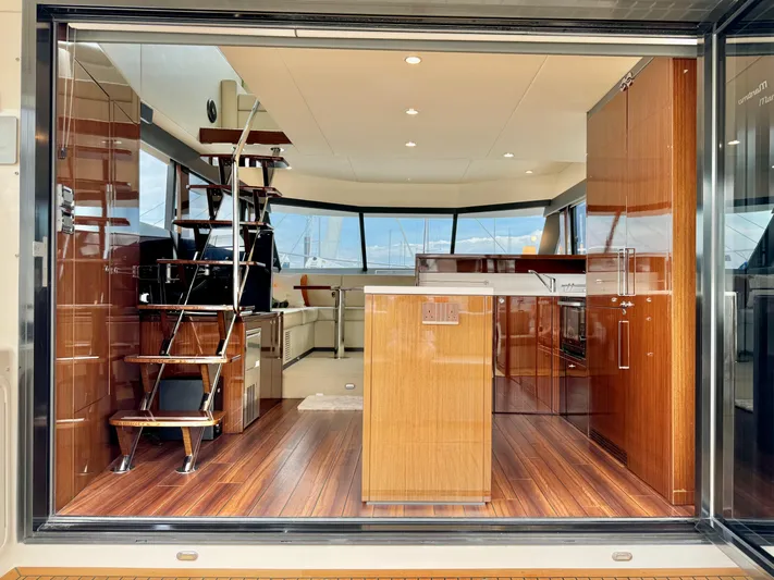 Waves III Yacht Photos Pics Interior view of 2017 Maritimo M51 yacht with wooden flooring and modern design.