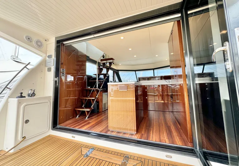 Waves III Yacht Photos Pics Luxurious interior of 2017 Maritimo M51 yacht with wooden flooring and modern design.