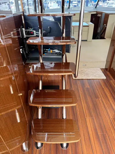 Waves III Yacht Photos Pics Staircase inside 2017 Maritimo M51 yacht with polished wood finish and modern design.