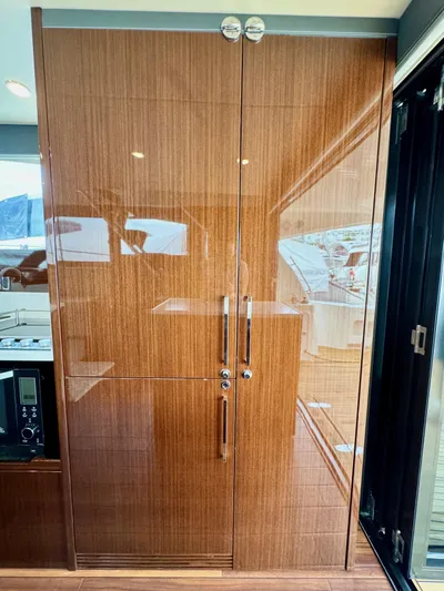 Waves III Yacht Photos Pics Luxurious wooden cabinetry inside a 2017 Maritimo M51 yacht.
