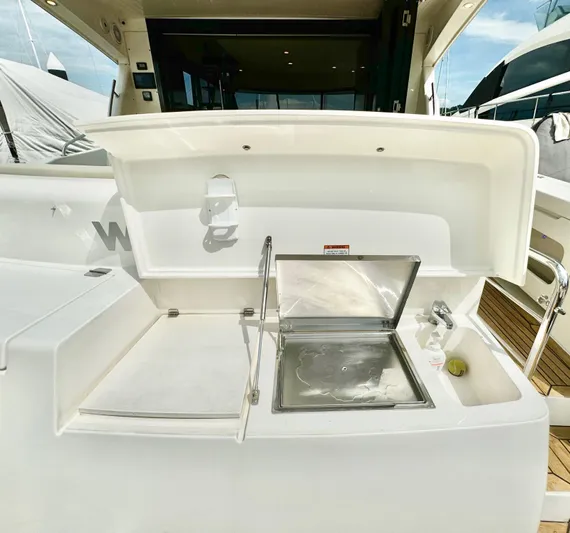 Waves III Yacht Photos Pics Outdoor sink area on a 2017 Maritimo M51 yacht, featuring a stainless steel basin.