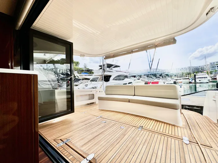 Waves III Yacht Photos Pics 2017 Maritimo M51 yacht with spacious deck and seating at marina.