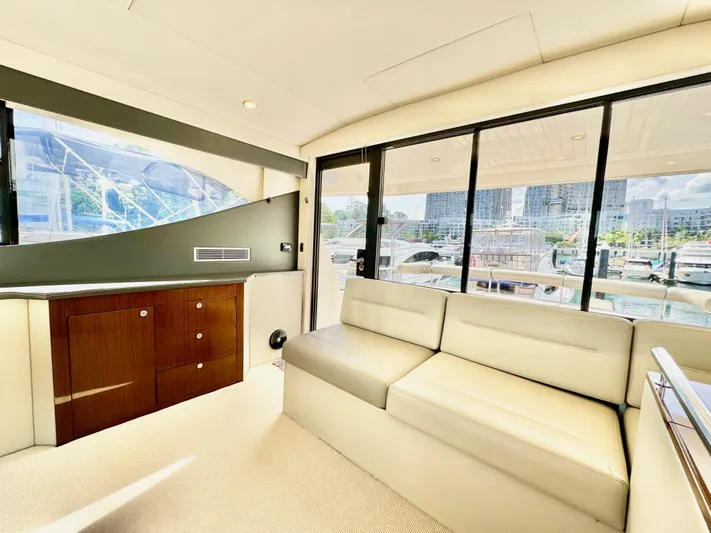 Waves III Yacht Photos Pics Luxurious interior of 2017 Maritimo M51 yacht with modern seating and large windows.