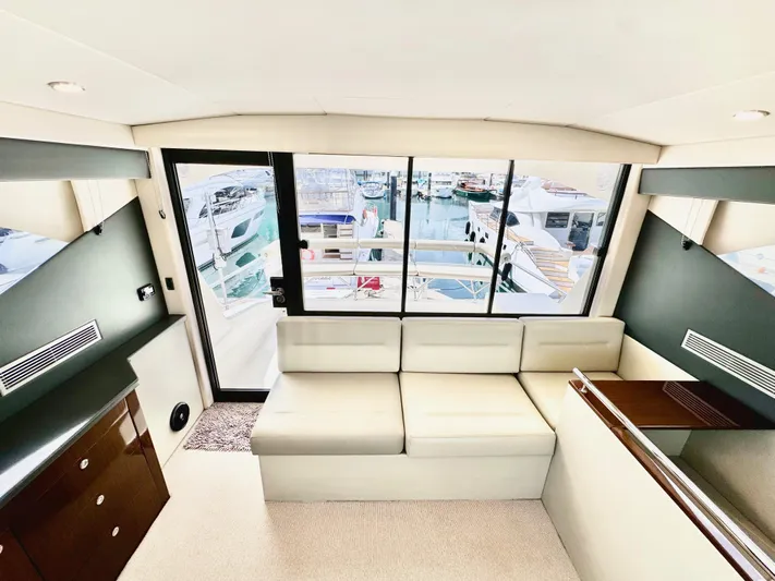 Waves III Yacht Photos Pics Interior of 2017 Maritimo M51 yacht with modern seating and marina view.