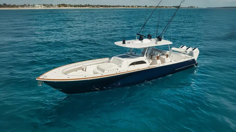 Bulldawg Yacht Photos Pics 2023 Valhalla Boatworks V-46 cruising on clear blue ocean waters.