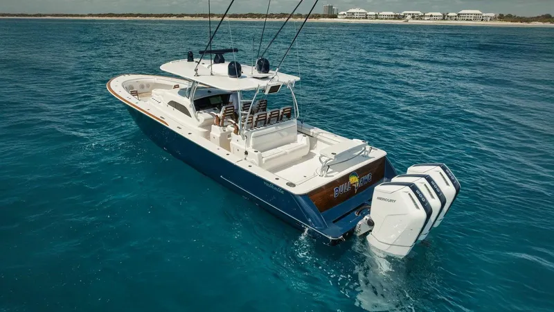 Bulldawg Yacht Photos Pics 2023 Valhalla Boatworks V-46 cruising on clear blue ocean waters.
