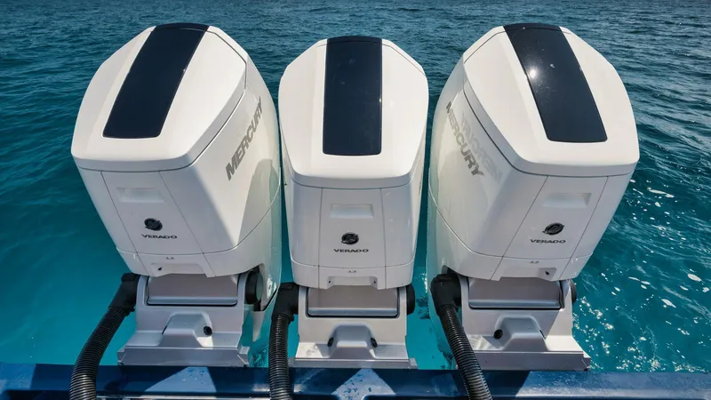 Bulldawg Yacht Photos Pics Triple Mercury Verado outboard engines on 2023 Valhalla Boatworks V-46, ocean backdrop.