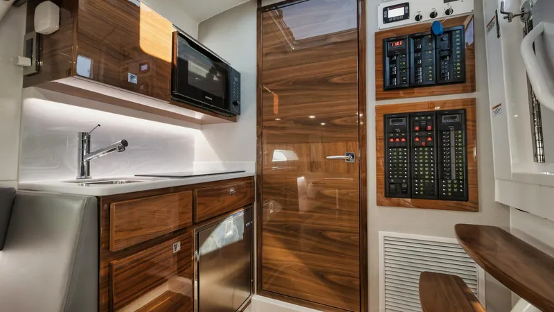 Bulldawg Yacht Photos Pics 2023 Valhalla V-46 interior with modern kitchen and control panels.