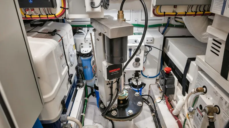 Bulldawg Yacht Photos Pics Engine room of 2023 Valhalla Boatworks V-46, featuring advanced Simrad equipment and organized wiring.