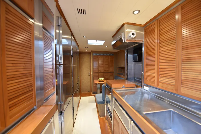 Green Eyes Yacht Photos Pics Luxurious wooden interior of 2001 Wally Full Displacement Sailing Yacht kitchen.