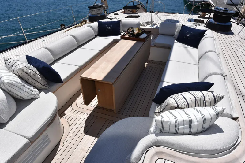 Green Eyes Yacht Photos Pics Luxurious deck seating on a 2001 Wally Full Displacement Sailing Yacht with striped cushions.