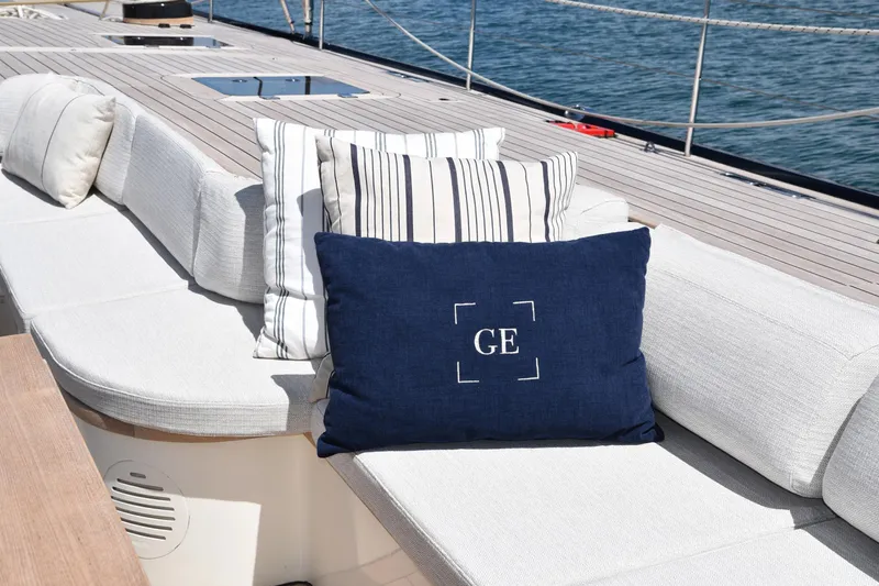 Green Eyes Yacht Photos Pics Luxurious seating area on a 2001 Wally Full Displacement Sailing Yacht with decorative cushions.