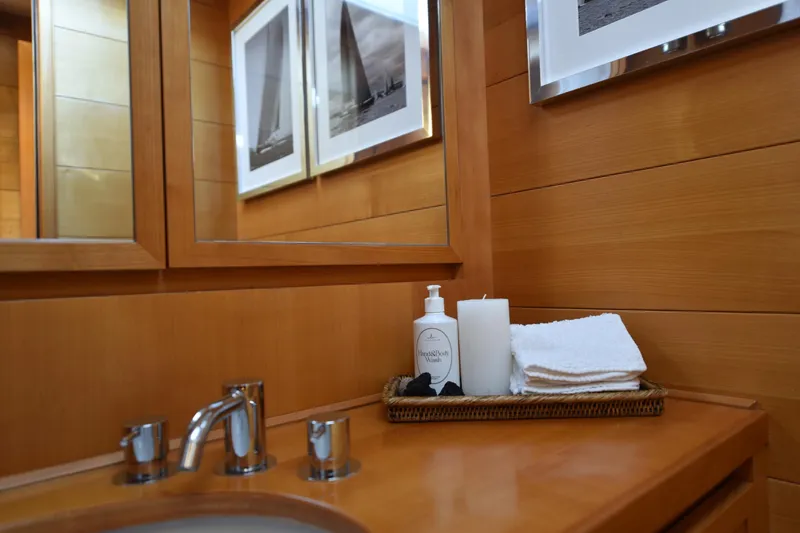 Green Eyes Yacht Photos Pics Luxurious bathroom on 2001 Wally Full Displacement Sailing Yacht with elegant wooden decor.