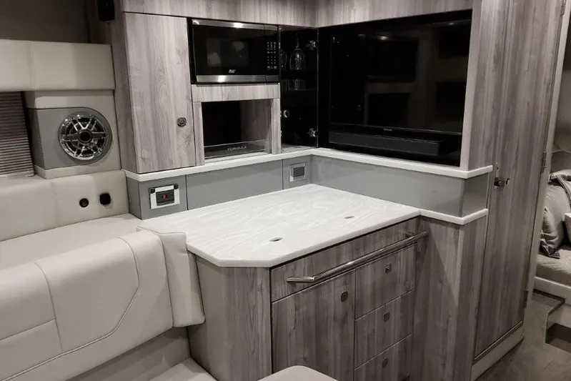  Yacht Photos Pics 2026 Formula 430 Super Sport Crossover interior with modern kitchen and entertainment area.