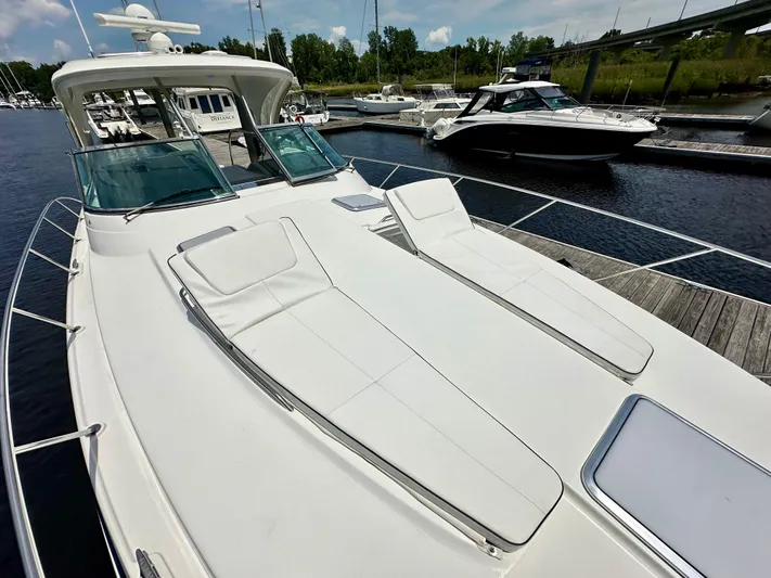 Brett Stancill Yacht Photos Pics 2019 Formula 40 Performance Cruiser docked at marina with sun loungers on deck.