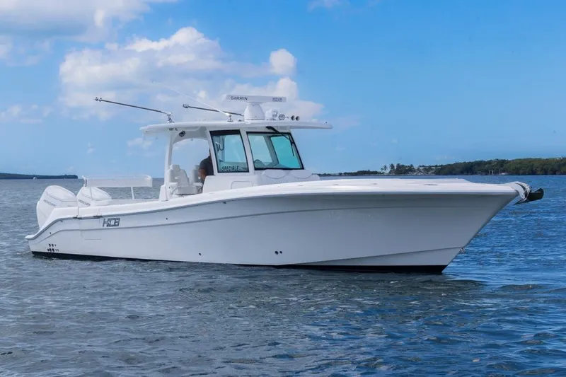  Yacht Photos Pics 2023 HCB 39 Speciale boat on calm water under blue sky.