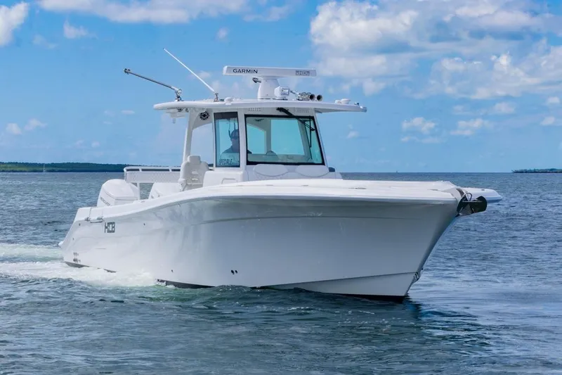  Yacht Photos Pics 2023 HCB 39 Speciale boat cruising on open water under a clear blue sky.