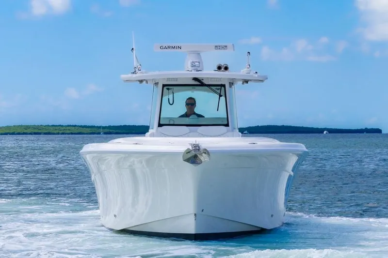  Yacht Photos Pics 2023 HCB 39 Speciale boat cruising on open water under clear blue sky.
