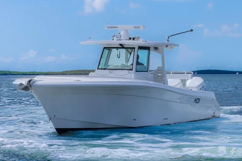  Yacht Photos Pics 2023 HCB 39 Speciale boat cruising on clear blue water.