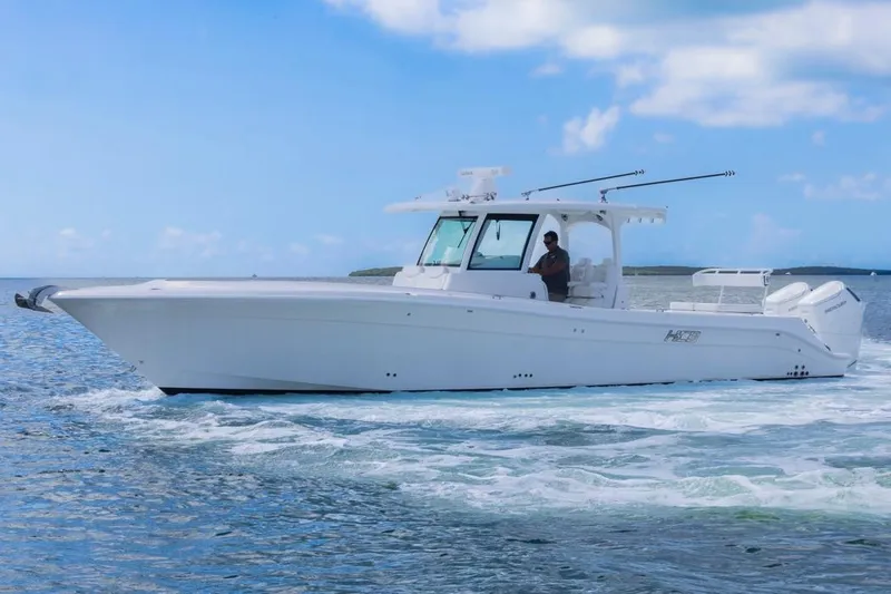  Yacht Photos Pics 2023 HCB 39 Speciale boat cruising on open water under a clear blue sky.