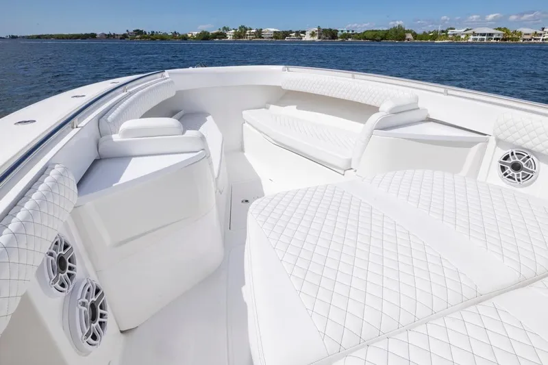  Yacht Photos Pics Luxurious 2023 HCB 39 Speciale boat interior with white quilted seating on open water.