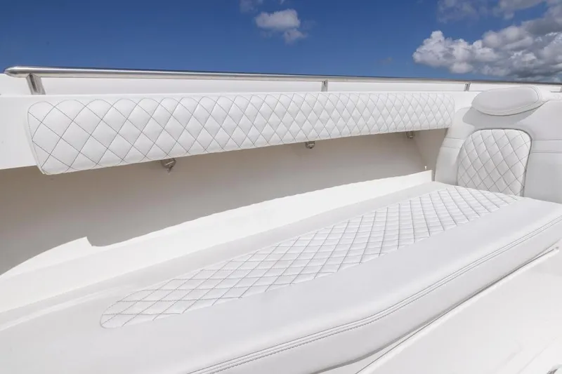  Yacht Photos Pics Luxurious white seating on 2023 HCB 39 Speciale boat under blue sky.