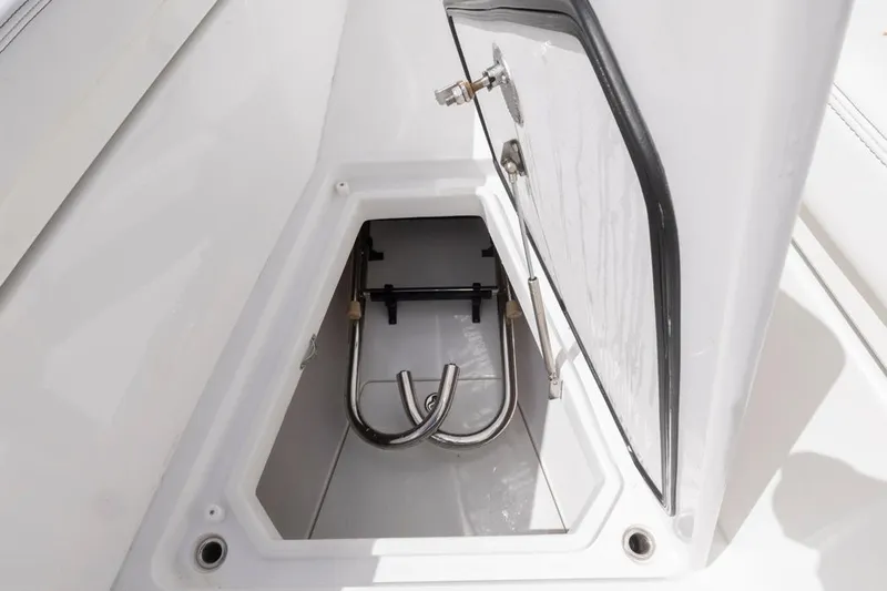  Yacht Photos Pics Open storage compartment on 2023 HCB 39 Speciale boat, featuring stainless steel hardware.