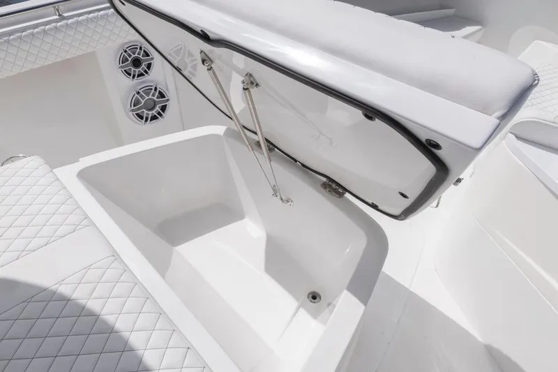  Yacht Photos Pics Open storage compartment on 2023 HCB 39 Speciale boat with quilted seating.