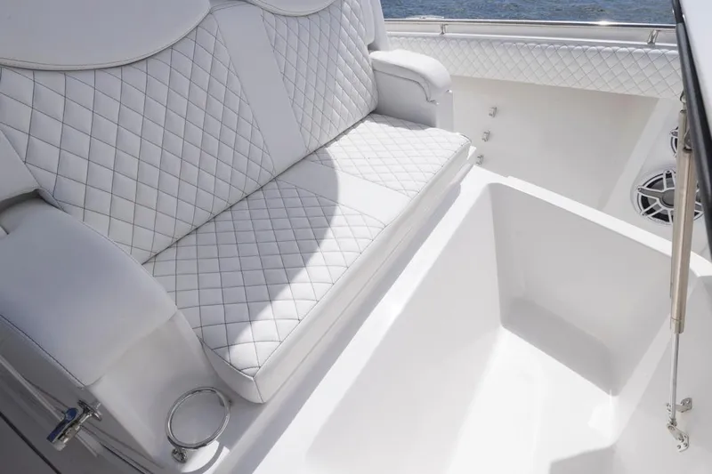  Yacht Photos Pics Luxurious white seating on 2023 HCB 39 Speciale boat, featuring diamond stitching.