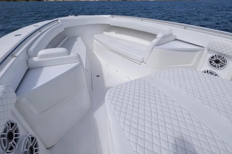  Yacht Photos Pics Luxurious interior of 2023 HCB 39 Speciale boat with white quilted seating.
