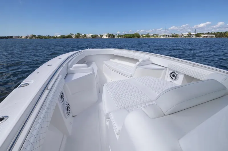  Yacht Photos Pics Luxurious 2023 HCB 39 Speciale boat interior with white seating on a calm blue sea.