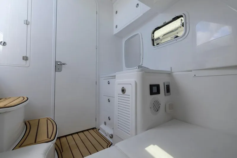 Yacht Photos Pics Interior of 2023 HCB 39 Speciale boat with white cabinetry and wood accents.