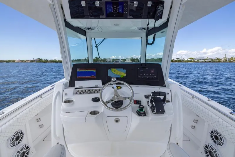  Yacht Photos Pics Helm of 2023 HCB 39 Speciale boat with navigation screens and controls on open water.