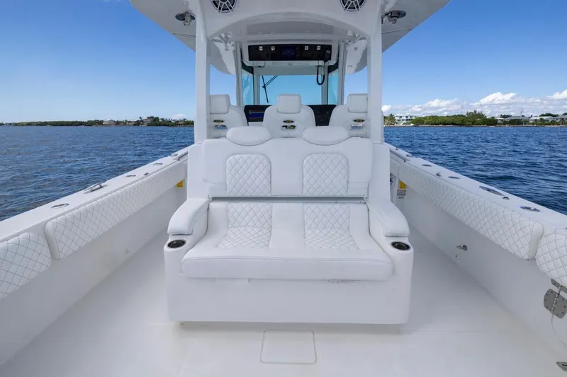  Yacht Photos Pics 2023 HCB 39 Speciale boat interior with luxurious white seating on open water.