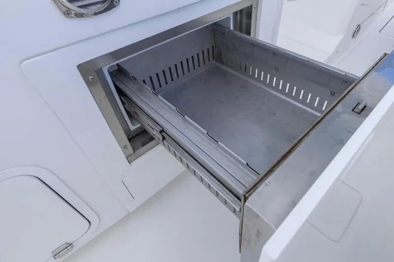  Yacht Photos Pics Open storage compartment on 2023 HCB 39 Speciale boat, showcasing sleek design.