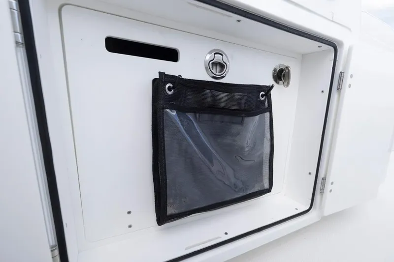  Yacht Photos Pics Storage compartment on 2023 HCB 39 Speciale boat, featuring a mesh pocket and secure latch.