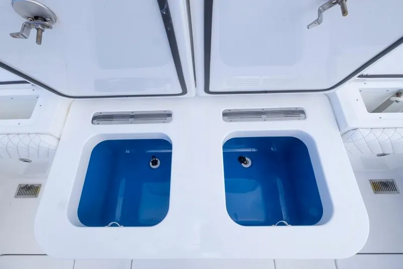  Yacht Photos Pics 2023 HCB 39 Speciale boat with dual blue livewells and storage compartments.