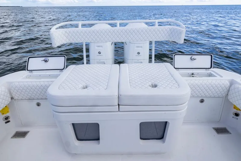  Yacht Photos Pics 2023 HCB 39 Speciale boat interior with white quilted seating and ocean backdrop.