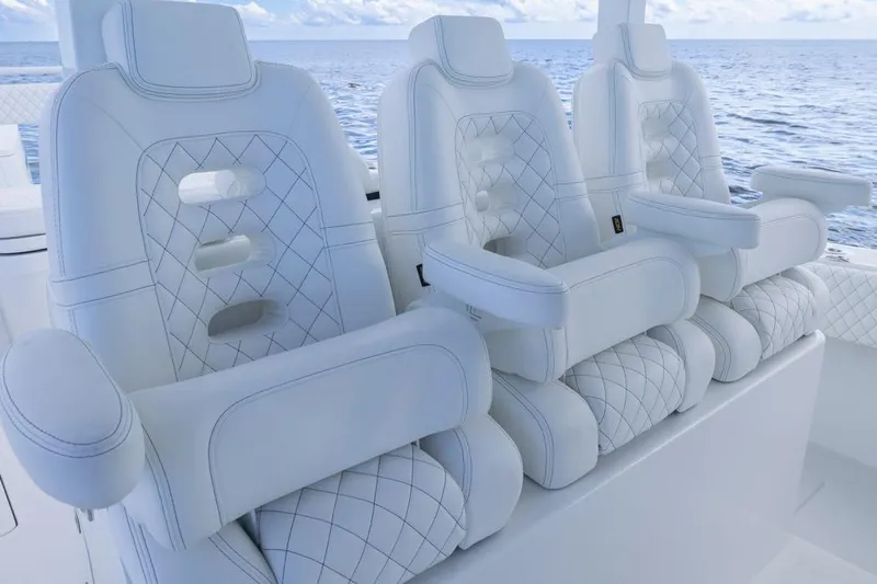  Yacht Photos Pics Luxurious white seating on 2023 HCB 39 Speciale boat, ocean backdrop.