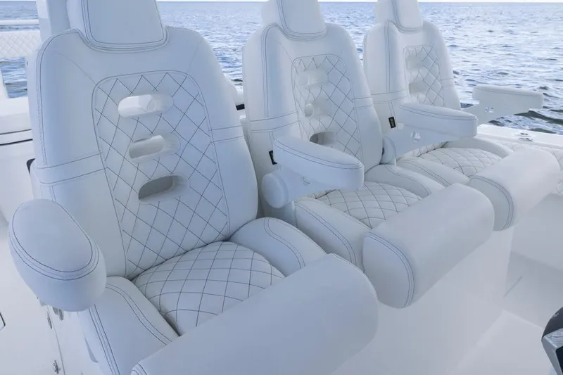  Yacht Photos Pics Luxurious white seating on 2023 HCB 39 Speciale boat, featuring diamond stitching.