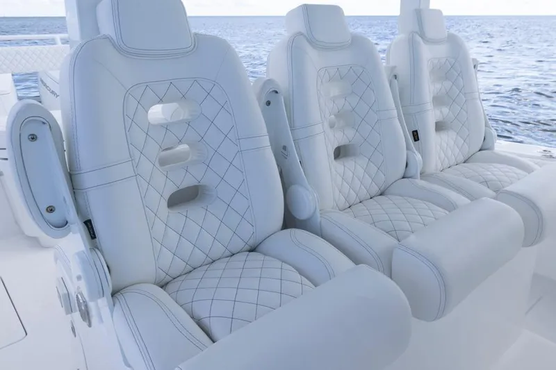  Yacht Photos Pics Luxurious white seating on 2023 HCB 39 Speciale boat, featuring diamond stitching.