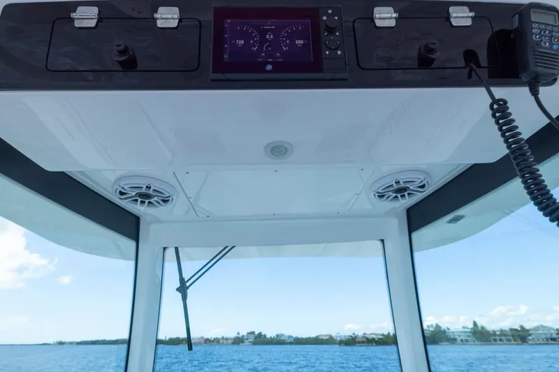  Yacht Photos Pics 2023 HCB 39 Speciale boat dashboard with navigation controls and ocean view.