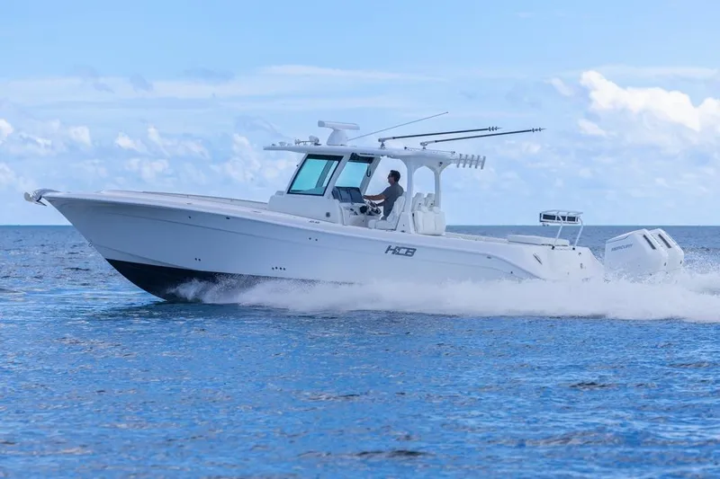  Yacht Photos Pics 2023 HCB 39 Speciale boat cruising on open water under a clear blue sky.